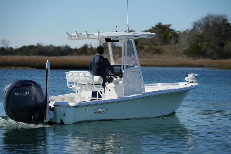 Slide: The Image of 2020 Sea Hunt BX 20 BR boat cruising on calm water with Yamaha engine. - 13