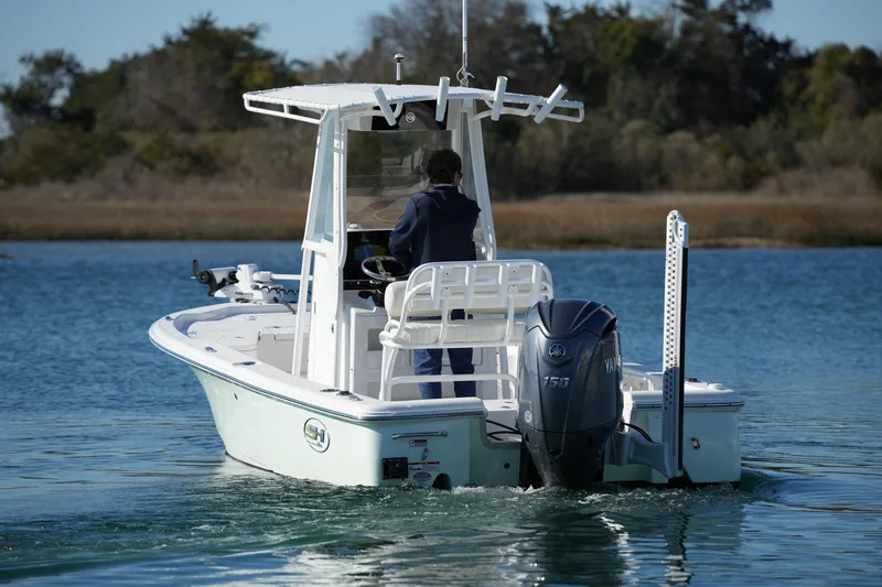 Slide: The Image of 2020 Sea Hunt BX 20 BR boat cruising on a calm lake with a Yamaha engine. - 15