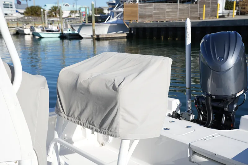 Slide: The Image of 2020 Sea Hunt BX 20 BR boat with covered console and outboard motor at marina. - 16
