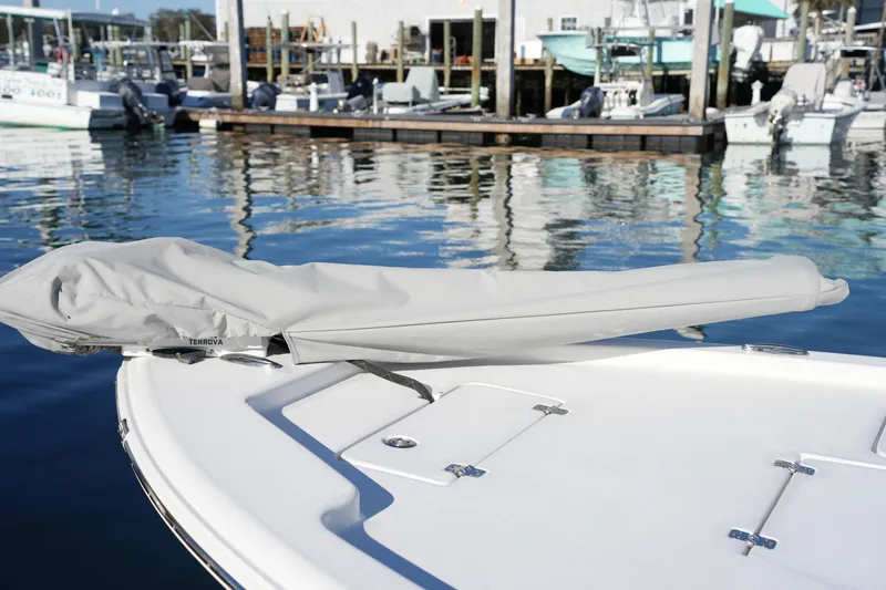 Slide: The Image of 2020 Sea Hunt BX 20 BR boat with covered equipment, docked at marina. - 18