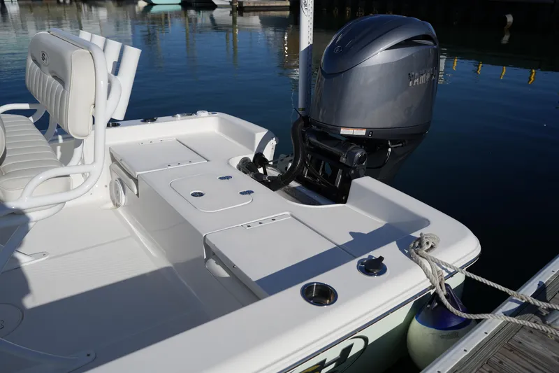 Slide: The Image of 2020 Sea Hunt BX 20 BR boat with Yamaha outboard motor docked at marina. - 20
