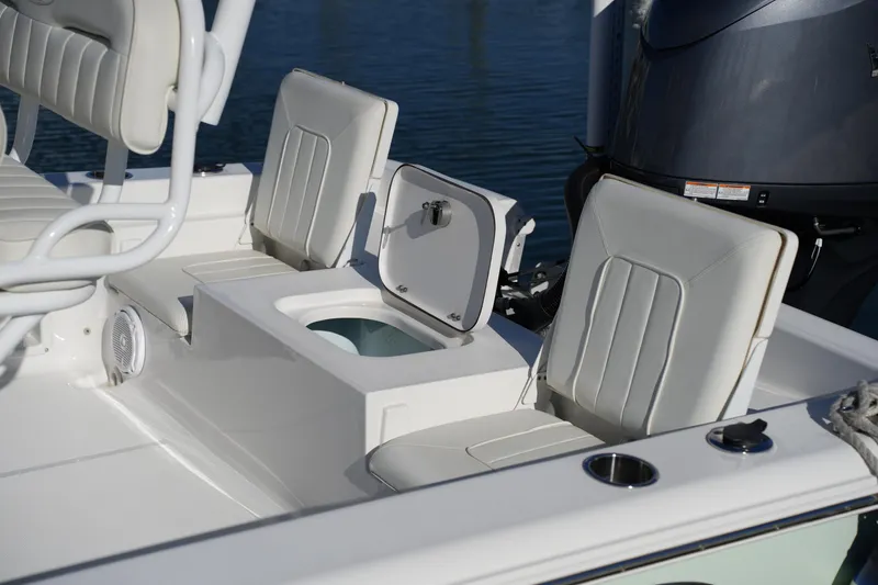 Slide: The Image of 2020 Sea Hunt BX 20 BR boat interior with seating and storage compartments. - 21