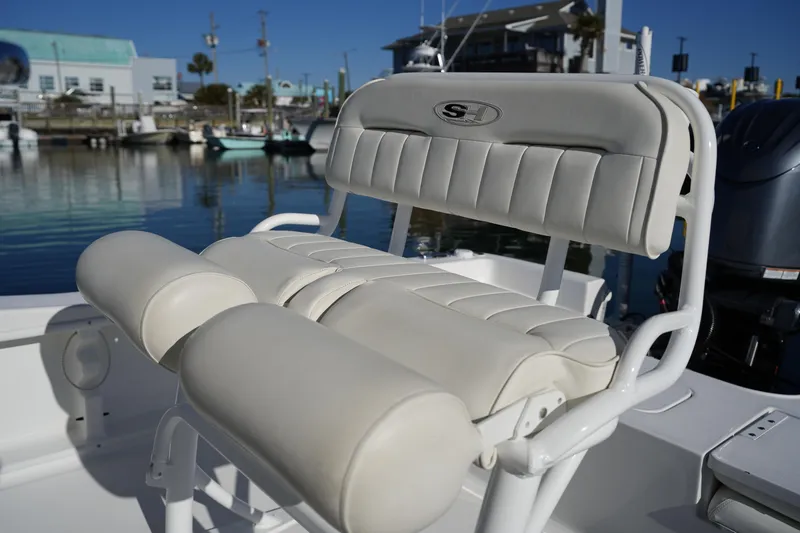 Slide: The Image of 2020 Sea Hunt BX 20 BR boat seat with white cushioned design, docked at marina. - 24
