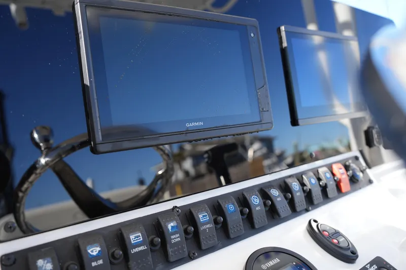 Slide: The Image of Control panel of 2020 Sea Hunt BX 20 BR boat with Garmin displays and switches. - 28