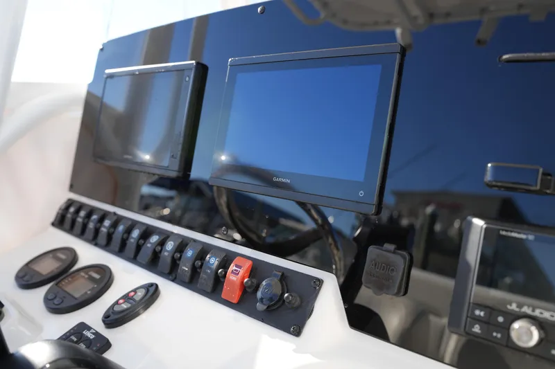 Slide: The Image of Control panel of 2020 Sea Hunt BX 20 BR boat with Garmin displays and switches. - 29