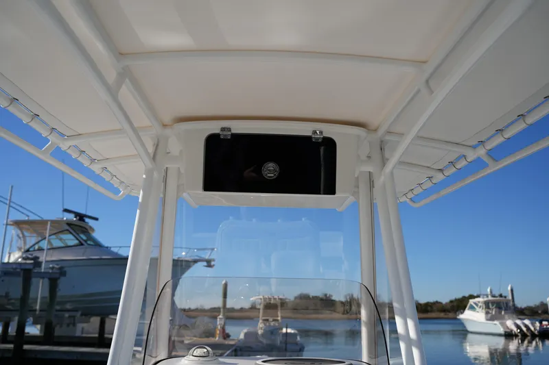 Slide: The Image of 2020 Sea Hunt BX 20 BR boat console with T-top, docked in marina. - 33