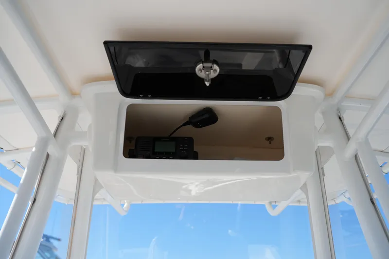 Slide: The Image of 2020 Sea Hunt BX 20 BR boat console with radio and storage compartment. - 34