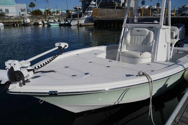 Slide: The Image of 2020 Sea Hunt BX 20 BR boat docked in a marina, featuring sleek design and modern equipment. - 37