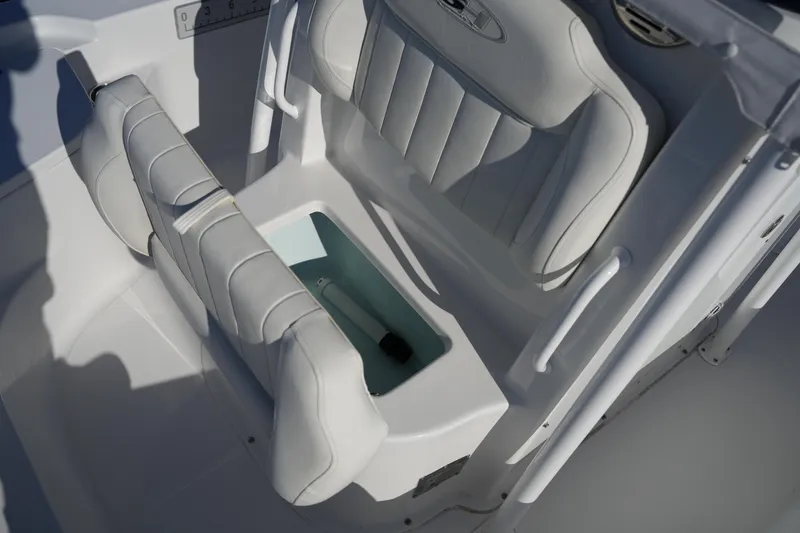 Slide: The Image of 2020 Sea Hunt BX 20 BR boat interior with cushioned seating and storage compartment. - 39
