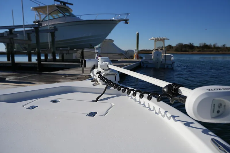 Slide: The Image of 2020 Sea Hunt BX 20 BR boat docked, featuring a trolling motor on a sunny day. - 41
