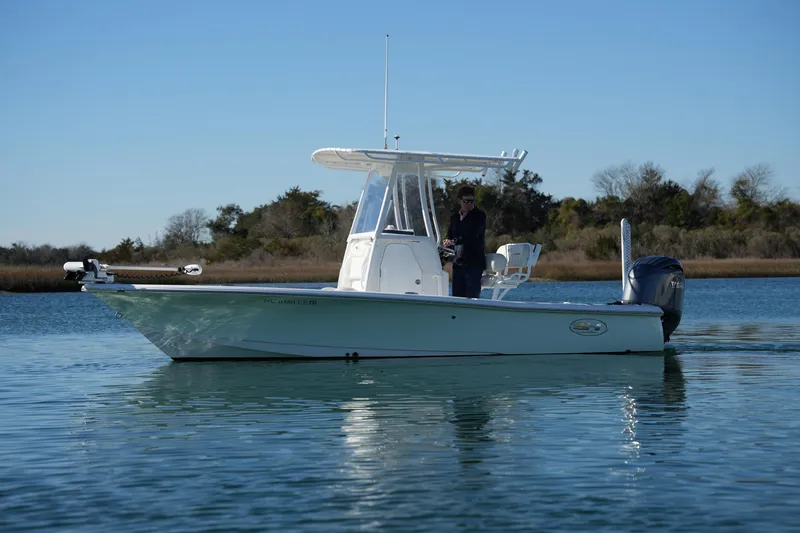 Slide: The Image of 2020 Sea Hunt BX 20 BR boat on calm water, clear sky background. - 6