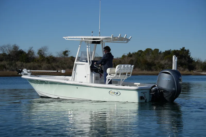 Slide: The Image of 2020 Sea Hunt BX 20 BR boat on calm water with Yamaha outboard motor. - 8