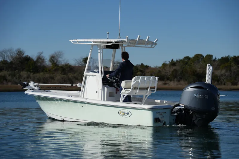 Slide: The Image of 2020 Sea Hunt BX 20 BR boat cruising on calm water with Yamaha outboard motor. - 9