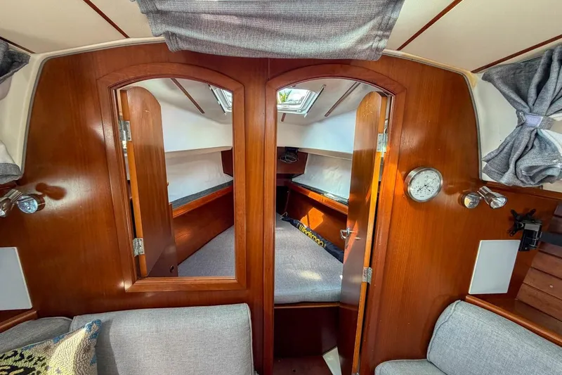 Slide: The Image of Interior of 1998 Beneteau Oceanis 36 CC sailboat with wooden finish and cozy cabin. - 11