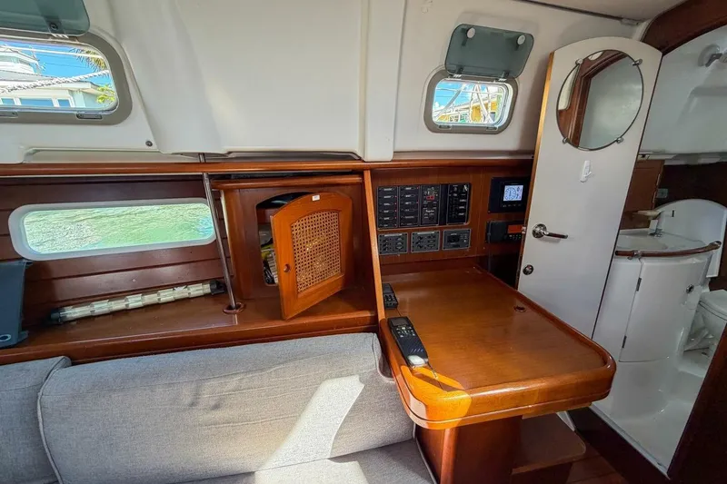 Slide: The Image of Interior of 1998 Beneteau Oceanis 36 CC yacht with wooden cabinetry and control panel. - 21
