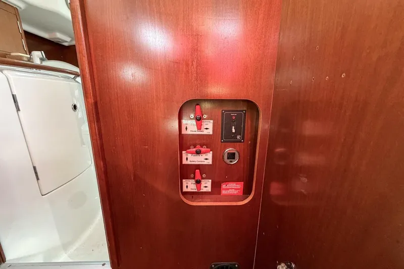 Slide: The Image of Electrical panel on 1998 Beneteau Oceanis 36 CC sailboat with wooden interior. - 27