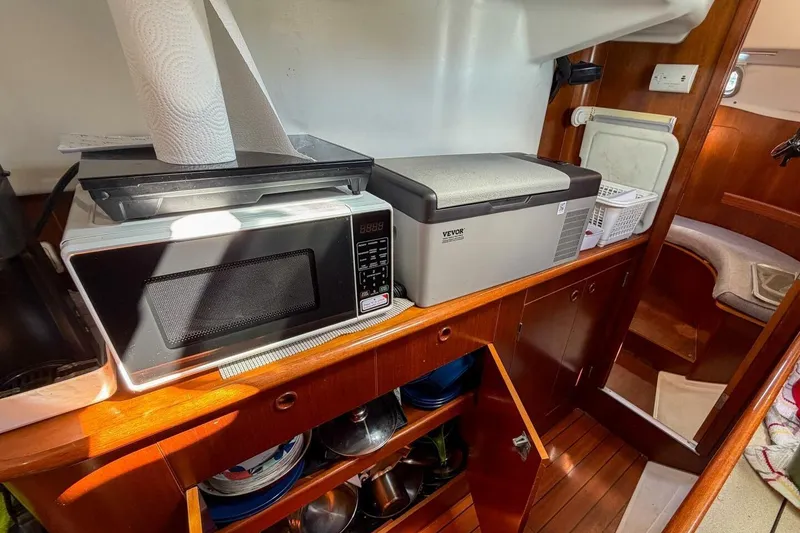 Slide: The Image of Interior of 1998 Beneteau Oceanis 36 CC yacht with microwave and compact fridge. - 31
