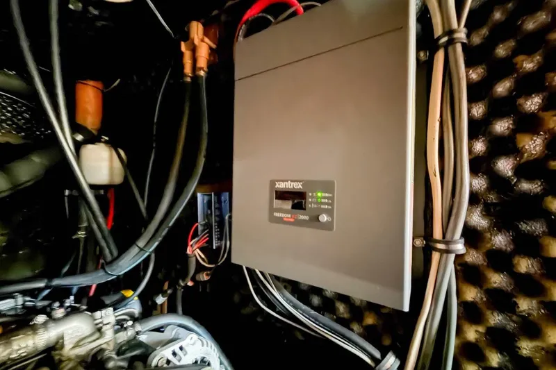 Slide: The Image of Electrical system inside a 1998 Beneteau Oceanis 36 CC sailboat, featuring a Xantrex inverter. - 44