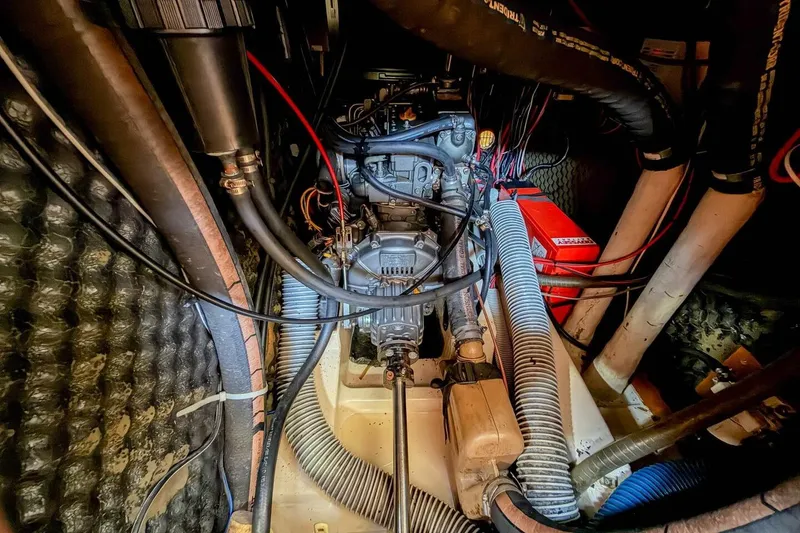 Slide: The Image of Engine room of 1998 Beneteau Oceanis 36 CC sailboat, showcasing mechanical components. - 45