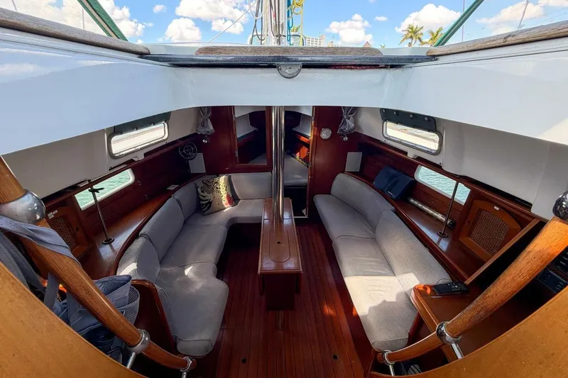 Slide: The Image of Interior of 1998 Beneteau Oceanis 36 CC sailboat with cozy seating and wooden finishes. - 47