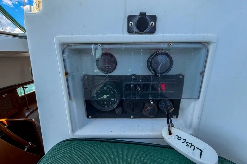 Slide: The Image of Control panel of 1998 Beneteau Oceanis 36 CC sailboat with gauges and switches. - 56