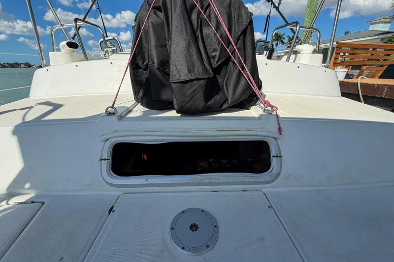 Slide: The Image of 1998 Beneteau Oceanis 36 CC sailboat deck with open hatch and ropes. - 59