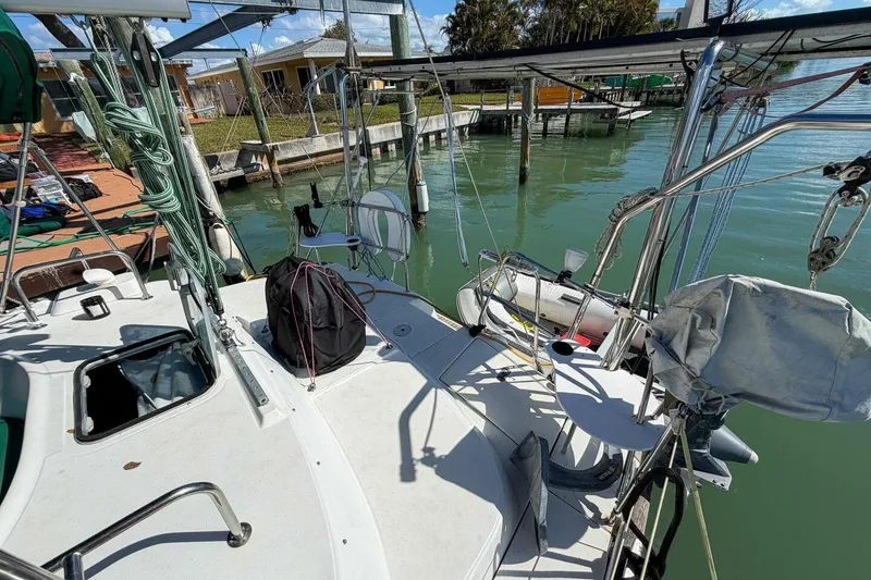Slide: The Image of 1998 Beneteau Oceanis 36 CC sailboat docked, featuring deck and rigging details. - 62