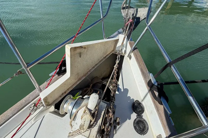 Slide: The Image of Bow of 1998 Beneteau Oceanis 36 CC sailboat with anchor and winch system. - 72