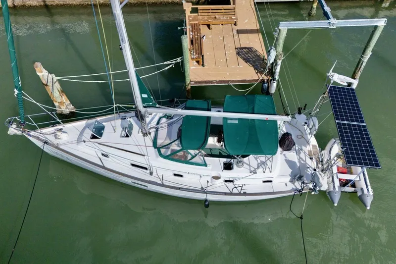 Slide: The Image of Overhead view of 1998 Beneteau Oceanis 36 CC sailboat docked with solar panels. - 76