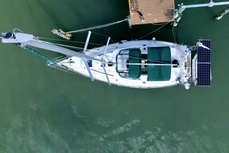 Slide: The Image of Overhead view of 1998 Beneteau Oceanis 36 CC sailboat docked, featuring solar panels. - 77