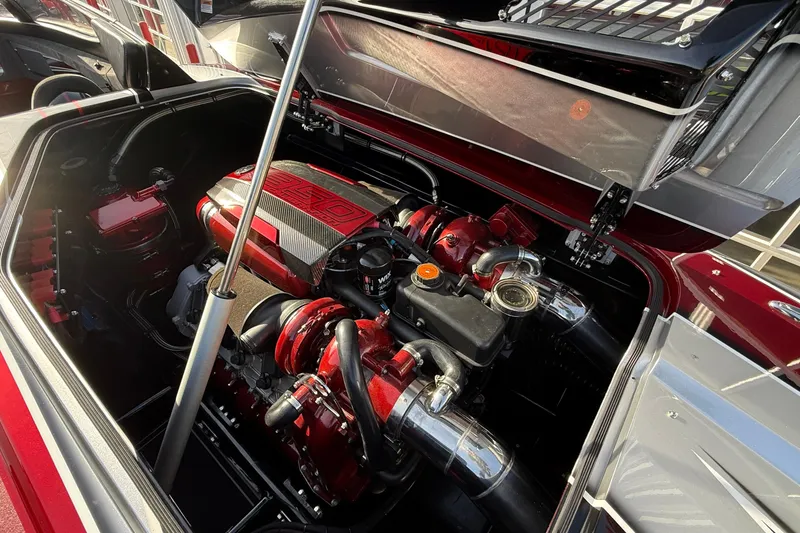 Slide: The Image of Engine compartment of 2018 MTI 43 R/P boat, showcasing powerful red engine components. - 10