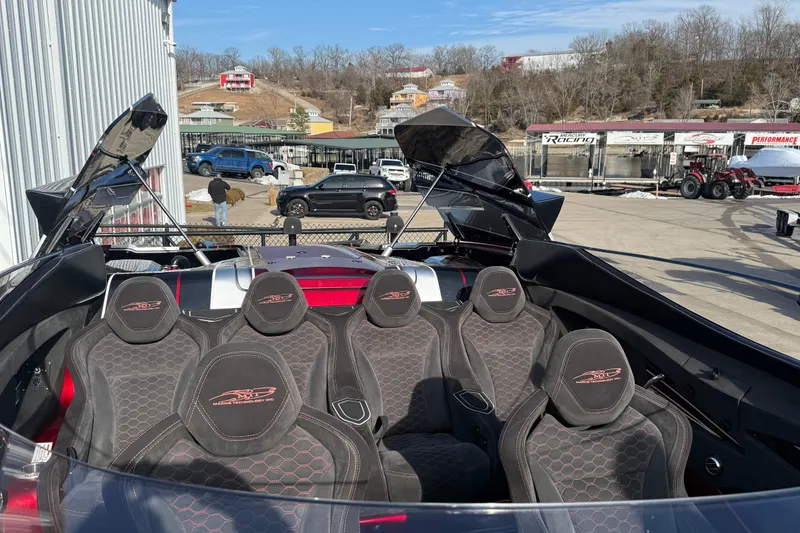 Slide: The Image of 2018 MTI 43 R/P boat with six seats, parked outdoors near a building. - 14