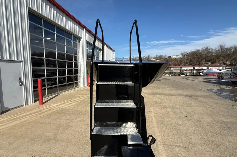 Slide: The Image of Staircase leading to MTI 43 R/P boat, 2018 model, near a garage. - 26