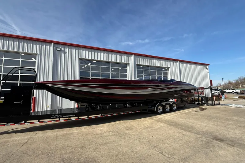 Slide: The Image of 2018 MTI 43 R/P powerboat on trailer outside industrial building. - 6