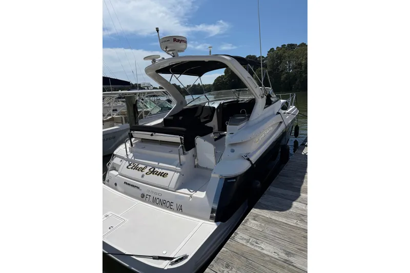 Slide: The Image of 2010 Regal 3360 Window Express boat docked, rear view, sunny day. - 4