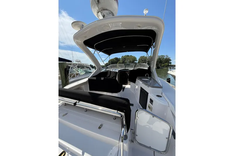 Slide: The Image of 2010 Regal 3360 Window Express boat interior with seating and canopy. - 5