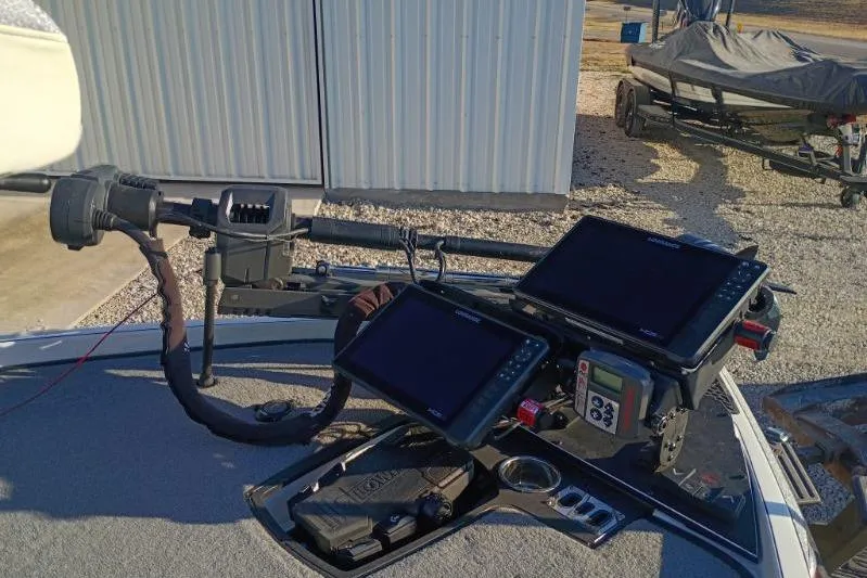 Slide: The Image of 2023 Ranger Z520R boat with advanced navigation and control systems on deck. - 3