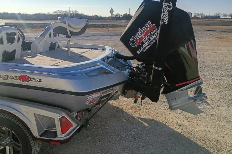 Slide: The Image of 2023 Ranger Z520R boat with powerful outboard motor in a sunny outdoor setting. - 6