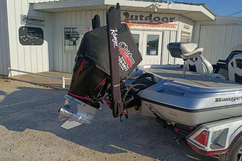 Slide: The Image of 2023 Ranger Z520R boat with covered motor at outdoor dealership. - 8