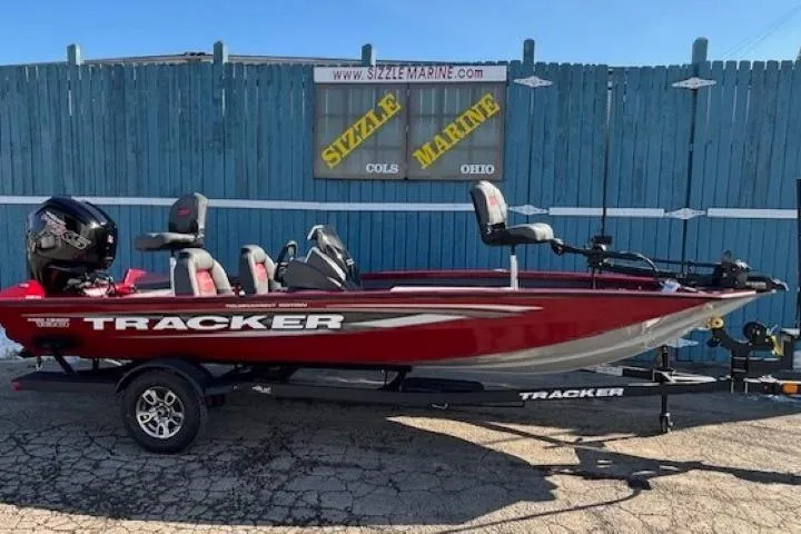 The Image of 2025 Tracker Pro Team 190 boat in red, parked on a trailer at Sizzle Marine. - 0