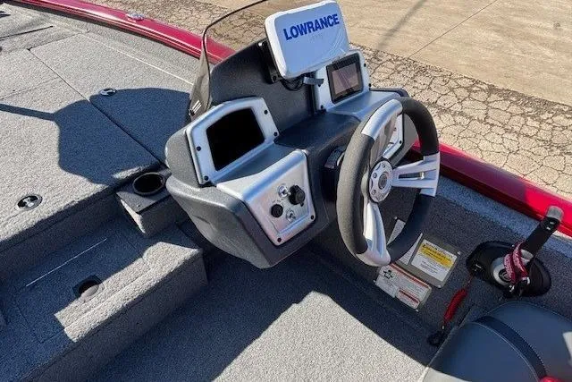 Slide: The Image of 2025 Tracker Pro Team 190 boat dashboard with Lowrance electronics and steering wheel. - 14