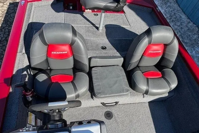 Slide: The Image of 2025 Tracker Pro Team 190 boat interior with dual seats and steering console. - 16