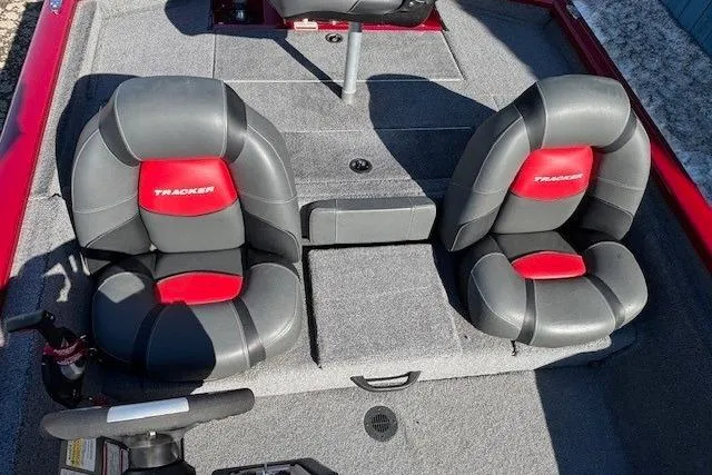 Slide: The Image of 2025 Tracker Pro Team 190 boat interior with two gray and red seats. - 17
