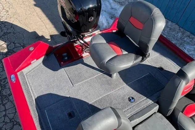 Slide: The Image of 2025 Tracker Pro Team 190 boat interior with gray and red seating. - 19