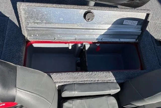 Slide: The Image of 2025 Tracker Pro Team 190 boat storage compartment with open lid, showing interior space. - 20