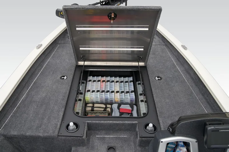 Slide: The Image of Manufacturer Provided Image: 2025 Tracker Pro Team 190 boat with open storage compartment, showcasing organized tackle boxes. - 24
