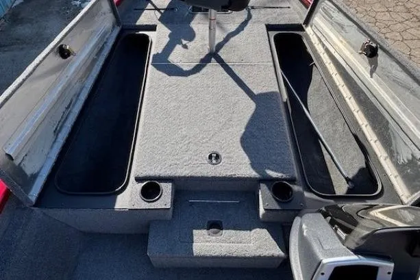 Slide: The Image of 2025 Tracker Pro Team 190 boat interior with storage compartments and seating. - 9