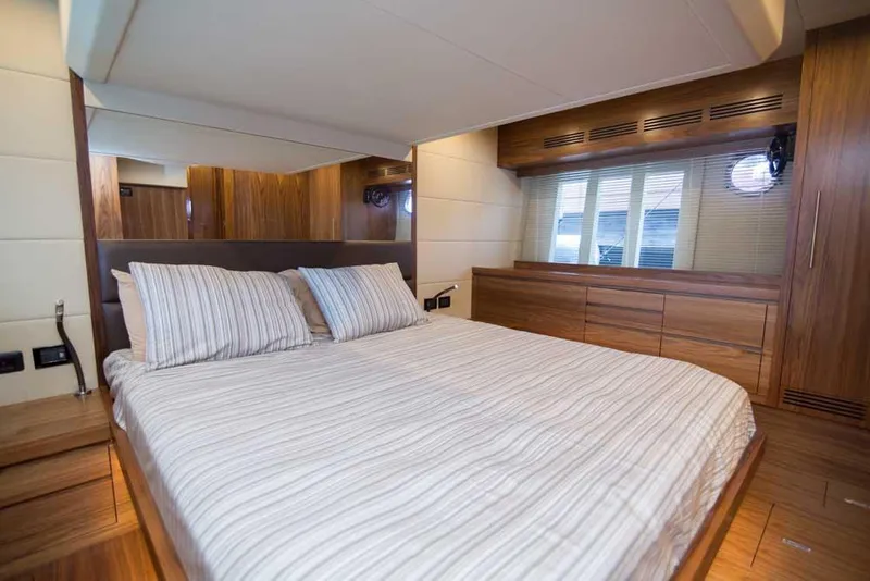 Slide: The Image of Luxurious bedroom interior of 2019 Sundeck Yachts 58 Sport with wood accents. - 4