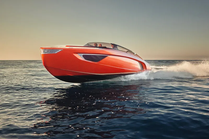 Slide: The Image of 2026 Flynt Yachts Centura 32 speeding on open water at sunset. - 3