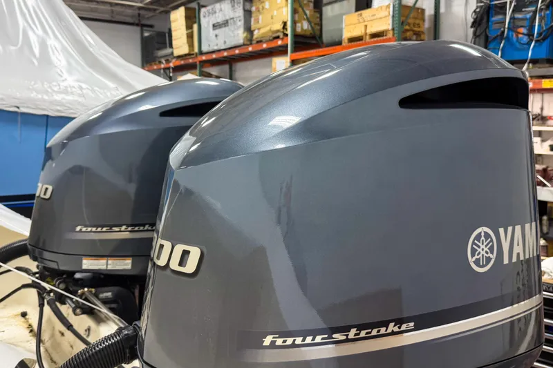 Slide: The Image of Twin Yamaha four-stroke outboard engines on a 2007 Pursuit OS 335 Offshore boat. - 21